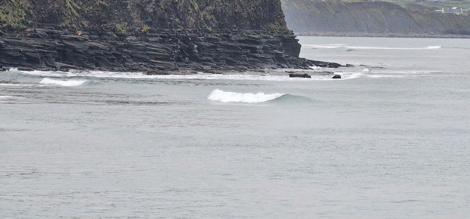 Small wave breaking at the pump house at high tide